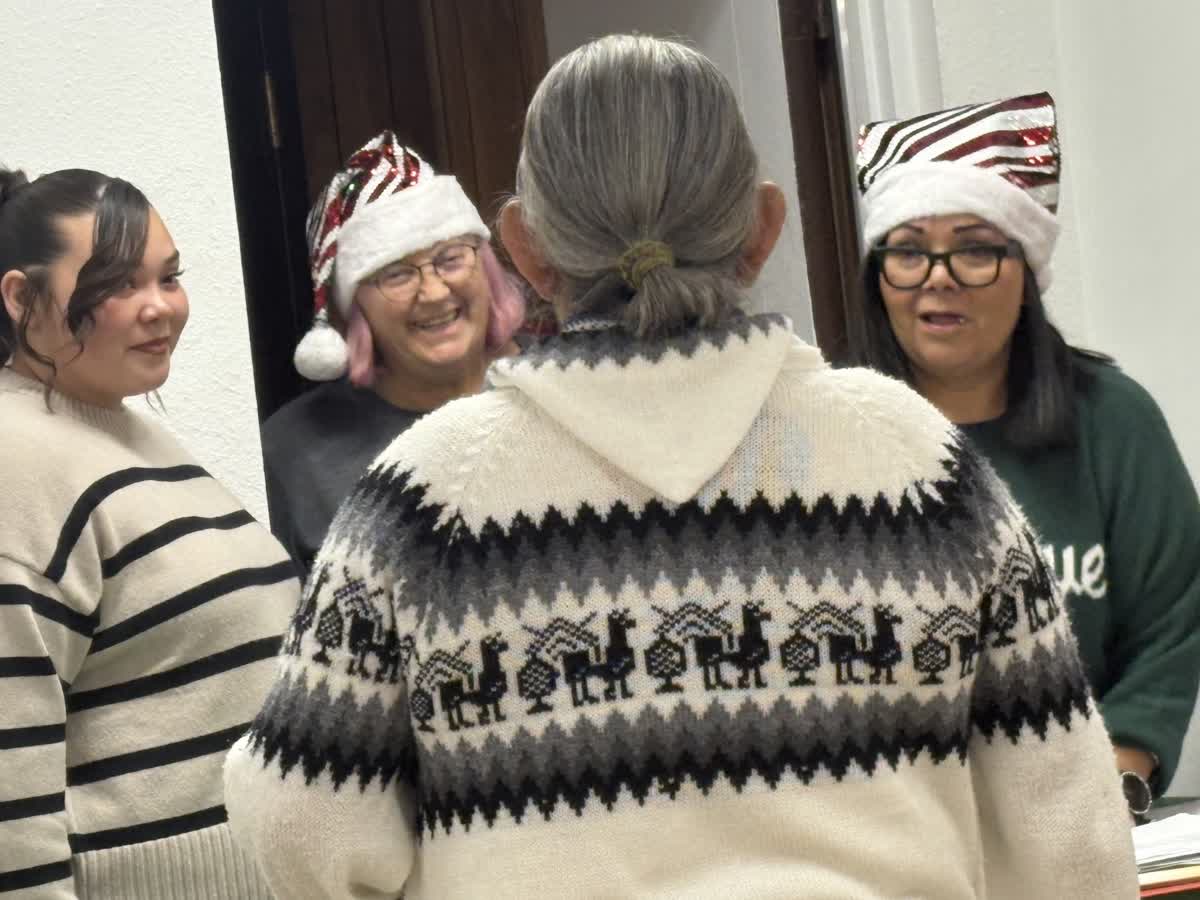 Volunteers in holiday hats at Angel Tree