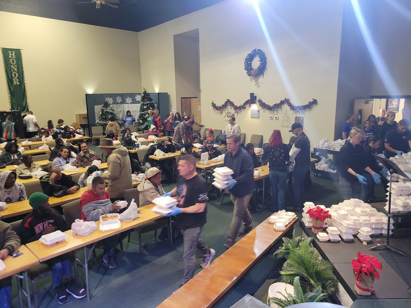 Long tables of neighbors at a holiday dinner