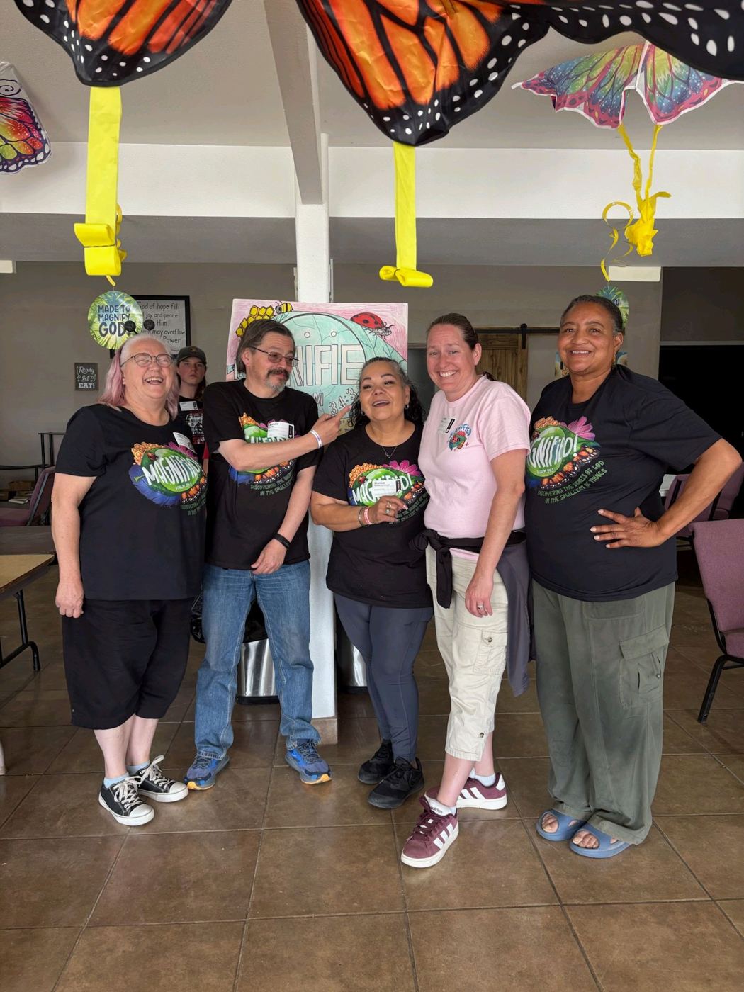Day camp volunteers in matching shirts
