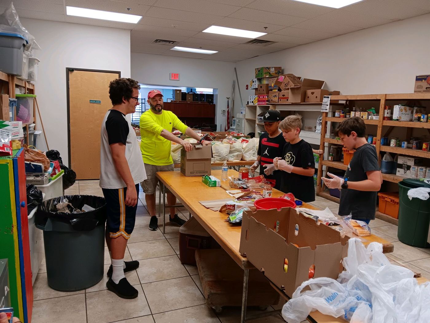 Volunteers sorting food for distribution
