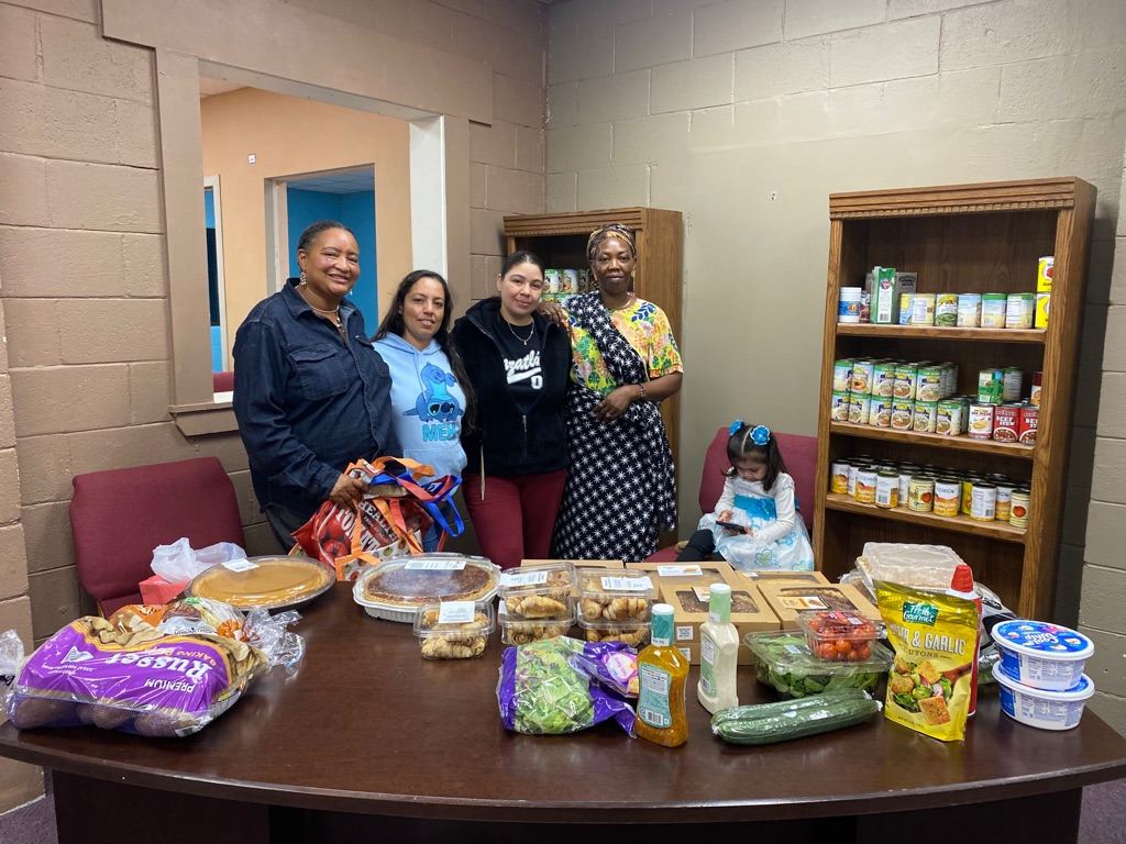 A Getting Ahead group setting out a meal before class