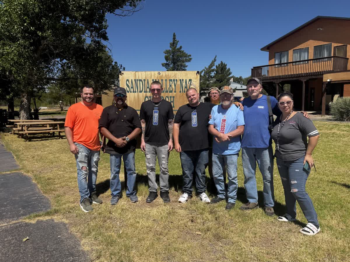 A mission team posing on the South Valley campus lawn