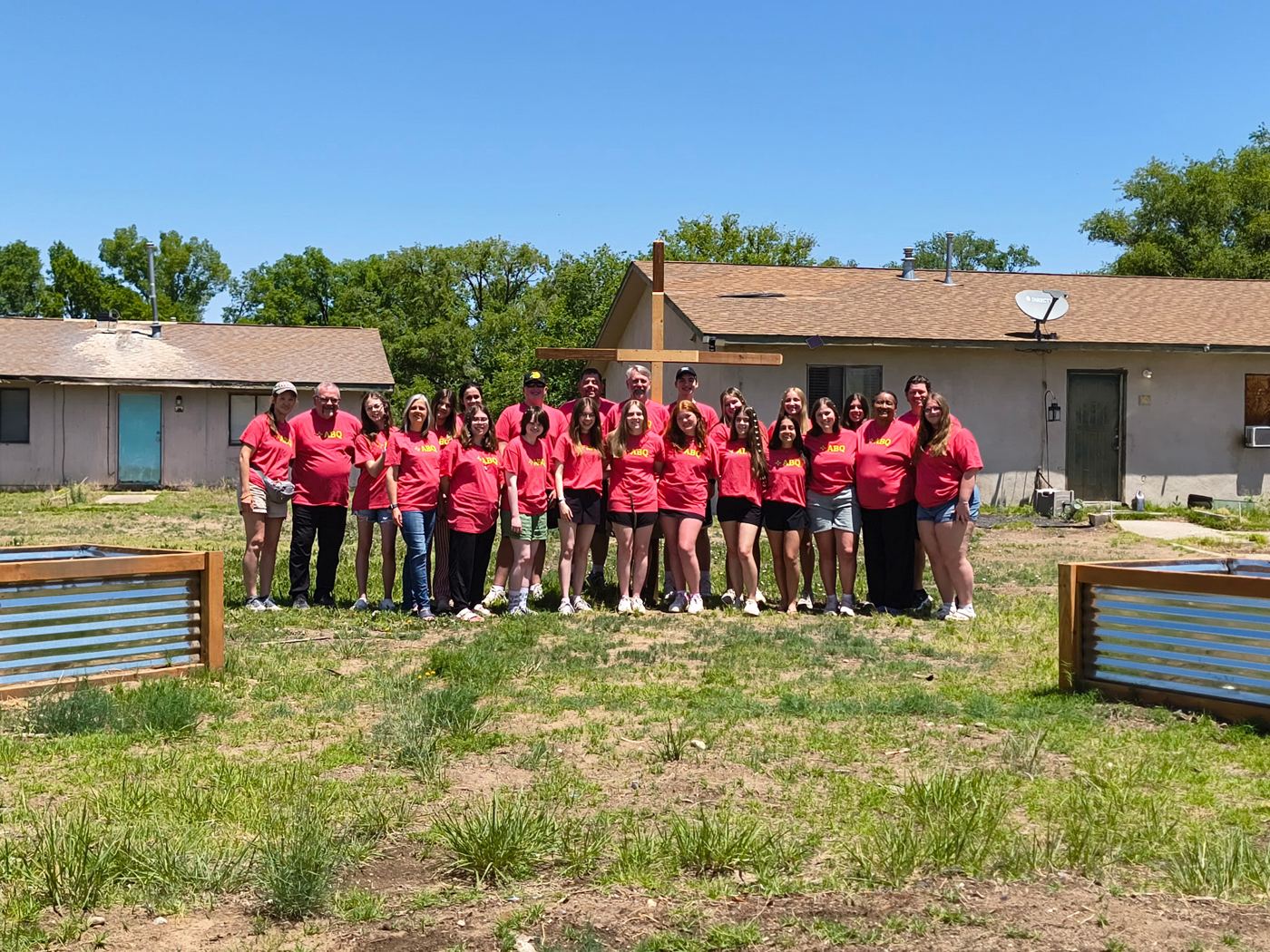 A mission team in matching red shirts