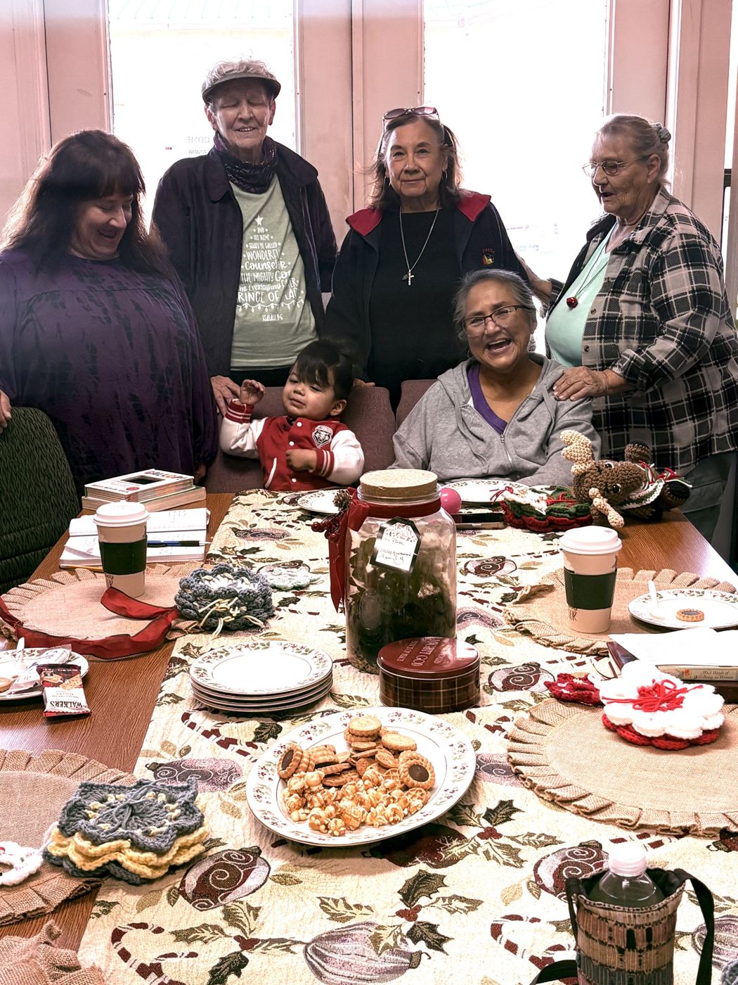 Women gathered around a table at the Mission Training Center