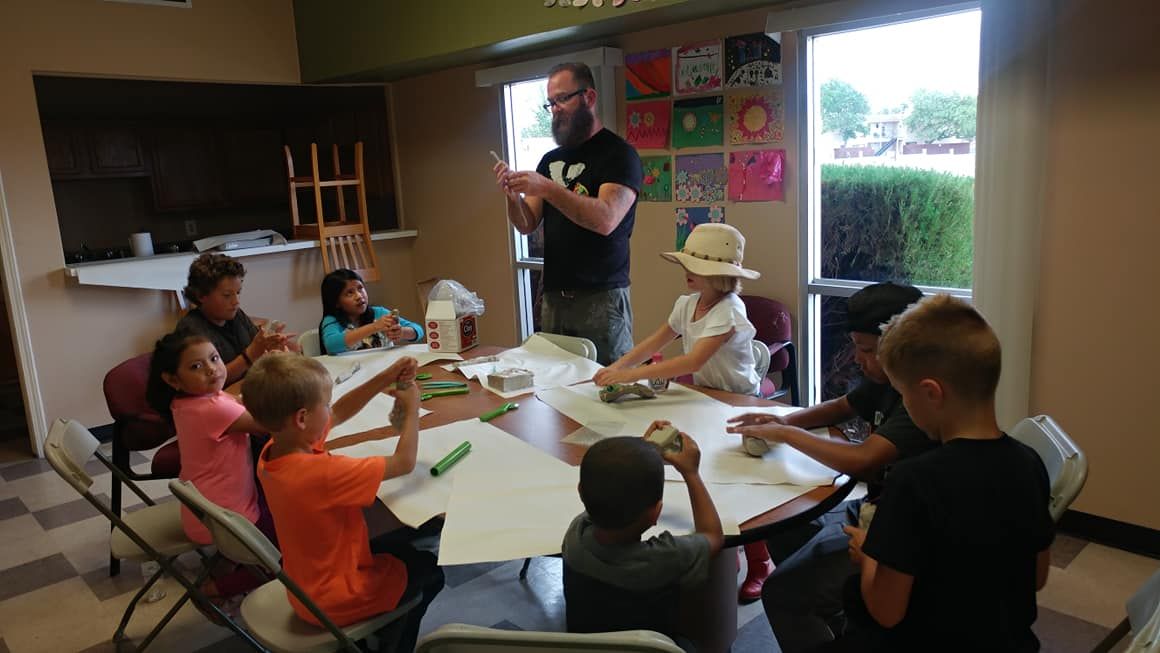 Kids doing an activity together at a table